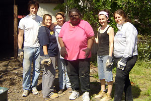 A resident of New Orleans (center) was very grateful to Hofstra students for helping to clear her property of debris. (Others from l to r) Hofstra students Olin Grant Parker, Slyse Dressler, Alice Dunn, Rachael Macisaac and Director of Student Activities Anita Ellis.