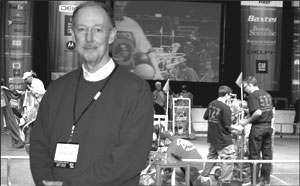 Dr. M. David Burghardt on the floor of the Hofstra Arena amidst the excitement of the second Long Island Regional Robotics FIRST Competition to be held at the University.