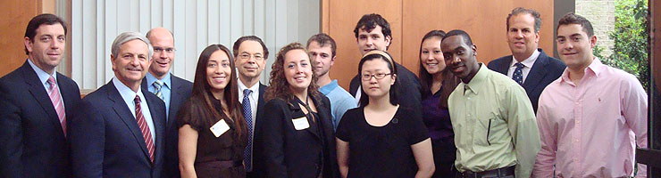 Internship students with Hofstra administrators and LIREG's David Einbinder, BBA '81, (second from right), who established the program with Hofstra.