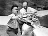 Agnew E. Larsen and Harold F. Pitcairn with the aerodynamic cyclic/collective pitch rotor head of the PA-36 Autogiro