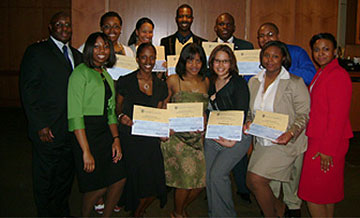 Black Hispanic Alumni Association (BHAA) board with scholarship recipients