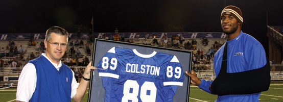 Former football great and current New Orleans Saint All-Pro Marques Colston, pictured with Director of Athletics Jack Hayes, had his jersey retired this past fall.