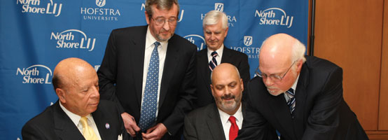 Chairman of the North Shore-LIJ Health System Board of Trustees Saul Katz, North Shore-LIJ Health System President and Chief Executive Officer Michael Dowling, Dean of the Hofstra University School of Medicine Lawrence G. Smith, then Chair of the Hofstra’s Board of Trustees John Miller, and Hofstra President Stuart Rabinowitz signed the agreement that moved plans forward for the Hofstra University School of Medicine.