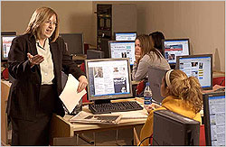 Professor teaching students in the computer lab