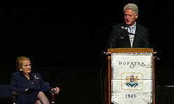 Madeleine Albright watches Bill Clinton deliver his address