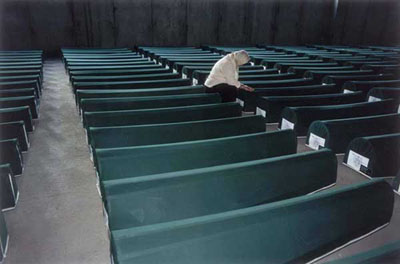 Srebrenica Survivor Among the Coffins