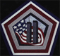 graphic of a  hand-made quilt by Jean McNamara entitled, "Memorial Quilt" showing the twin towers and the armerican flag