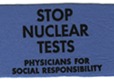 An armband used in one of the PSR protests that reads: STOP NUCLEAR TESTS