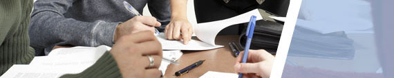 Students with pens and paper