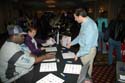 Attendees learning about new products and publications at the vendors' showcase