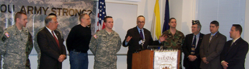 U.S. Senator Charles E. Schumer with guests, including LTC. William Abb, Professor of Military Science and head of Hofstra's ROTC program.