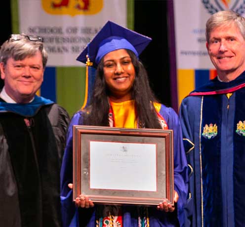 Sinjita Bhattacharya ’23 was awarded the Axinn Library Undergraduate Research Award at commencement. (L to r) HCLAS Acting Dean Daniel Seabold, Bhattacharya, and Provost Charlie Riordan.