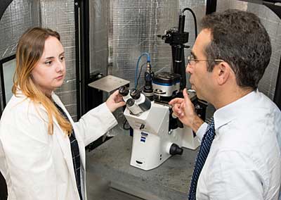 Student and professor with Microscope