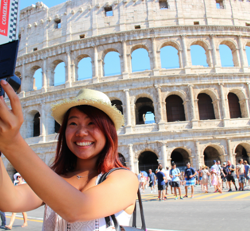 Student taking a photo in Rome.