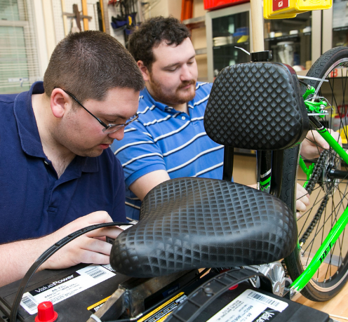 engineering students working on a bicycle design project