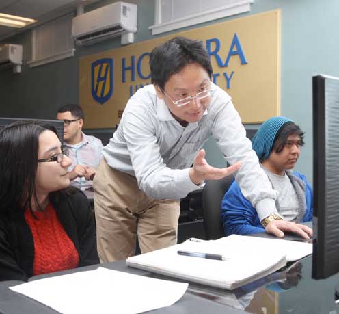 Professor Xiang Fu with students in the Big Data Laboratory. 