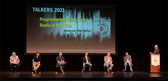 McVay Media Consulting president Mike McVay (right) moderates the “Programming News/Talk Radio in the ’20s” panel at TALKERS 2021 at Hofstra University on Friday, June 11. Panelists were (from l-r): Joe Thomas, program director/morning host, WCHV, Charlottesville, VA; Greg Stocker, WPHT, Philadelphia APD, executive producer for the Rich Zeoli show; Michael Czarnecki, program director WONK-FM, Washington, DC and the iHeartPodcast Channel; Josh Leng, CEO, Talk Media Network; Dave LaBrozzi, SVP of programming,