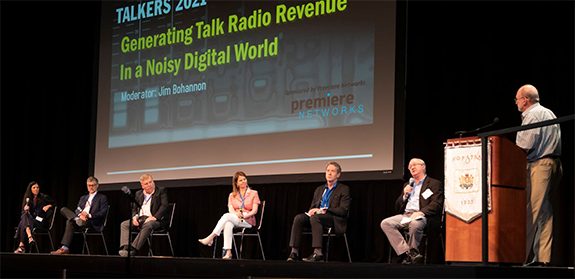 Westwood One nationally syndicated talk host Jim Bohannon (right) moderates the “Generating Talk Radio Revenue in a Noisy Digital World” panel at TALKERS 2021 at Hofstra University on Friday, June 11. Panelists were (from l-r): Christine Travaglini, president Katz Radio Group/RAB; Marc Beaven, general manager, WCBM, Baltimore; Paul Gleiser, president/owner KTBB, Tyler, TX; Kathy Carr, president, Howie Carr Radio Network; Erik Hellum, COO, Townsquare Media/RAB; and Paul Vandenburgh, owner/morning host, WGDJ,