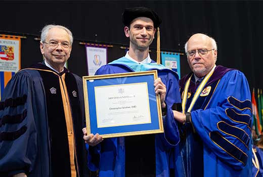 Robinson Award 2019:  Dr. Christopher Sclafani, Ph.D. in Literacy Studies, recipient of Hofstra University’s Outstanding Dissertation Award, December 19. 2019.  Photograph by Philip Hinds.
