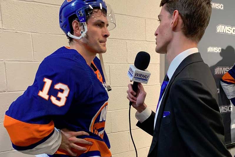 NY Islander star player Mathew Barzal speaking on the air with WRHU student reporter Sage Camosse during intermission of an Islanders game