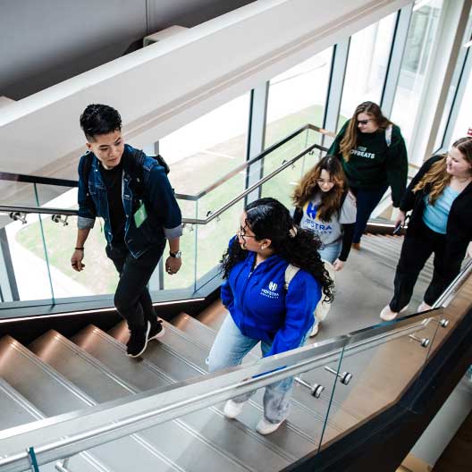 Students walking up stairwell