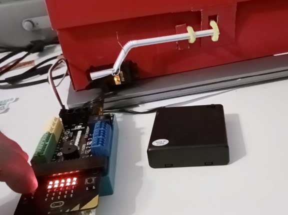 A shoe box, design a lock with a code that allows the lock to be digitally locked and unlocked.