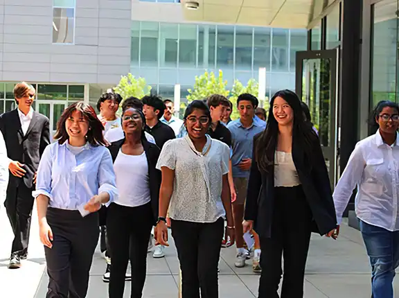 Smiling students walking on campus
