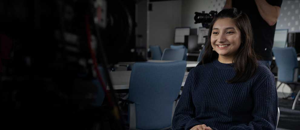 Student being interviewed in a studio