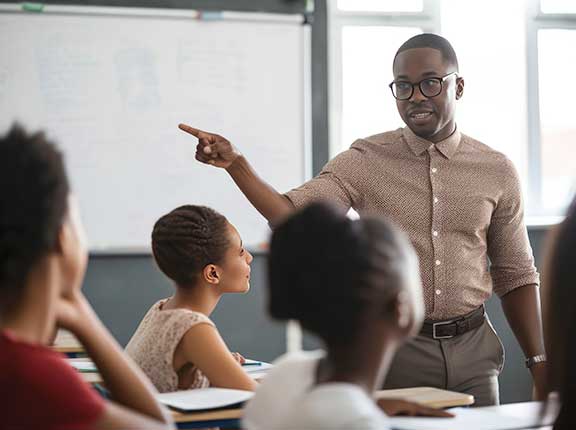African American teacher in classroom setting