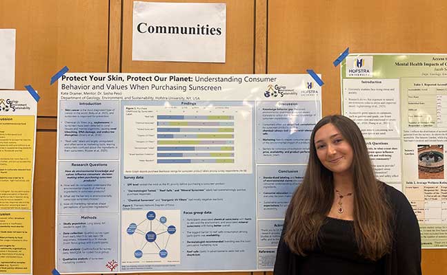 Kate Dramer with her research poster at Hofstra's Graduate Research Day.