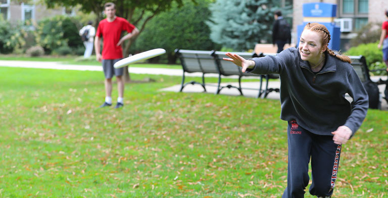 Student catchign a frisbee