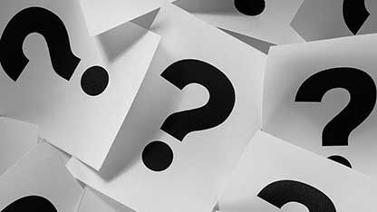 Question Mark on a stack of papers