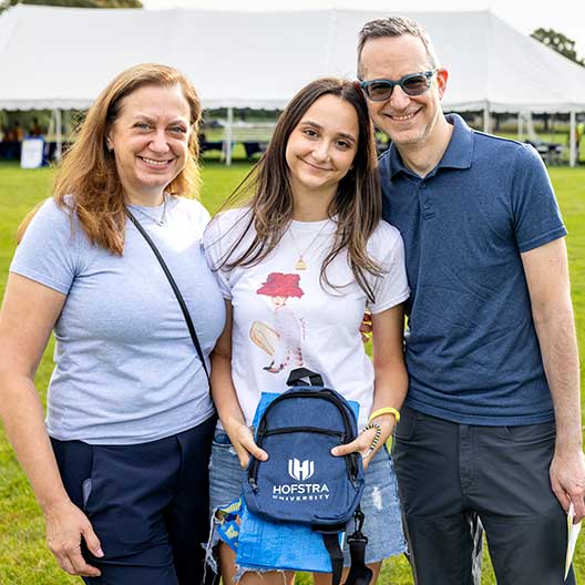 Smiling student with her family