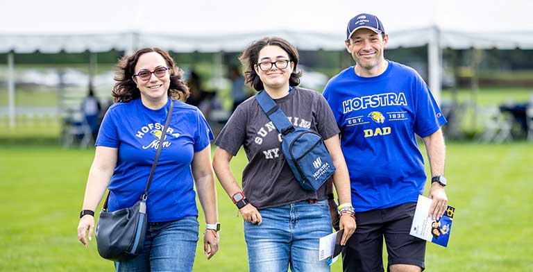 Smiling student with her family