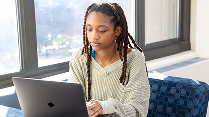 Student looking at laptop